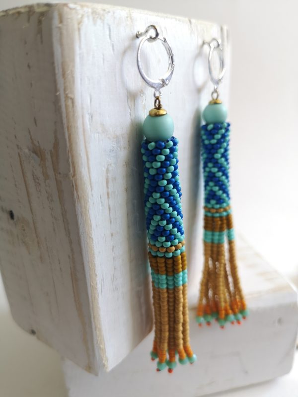 Boucles d'oreilles tissées, Héritage