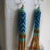 Boucles d'oreilles tissées, Héritage